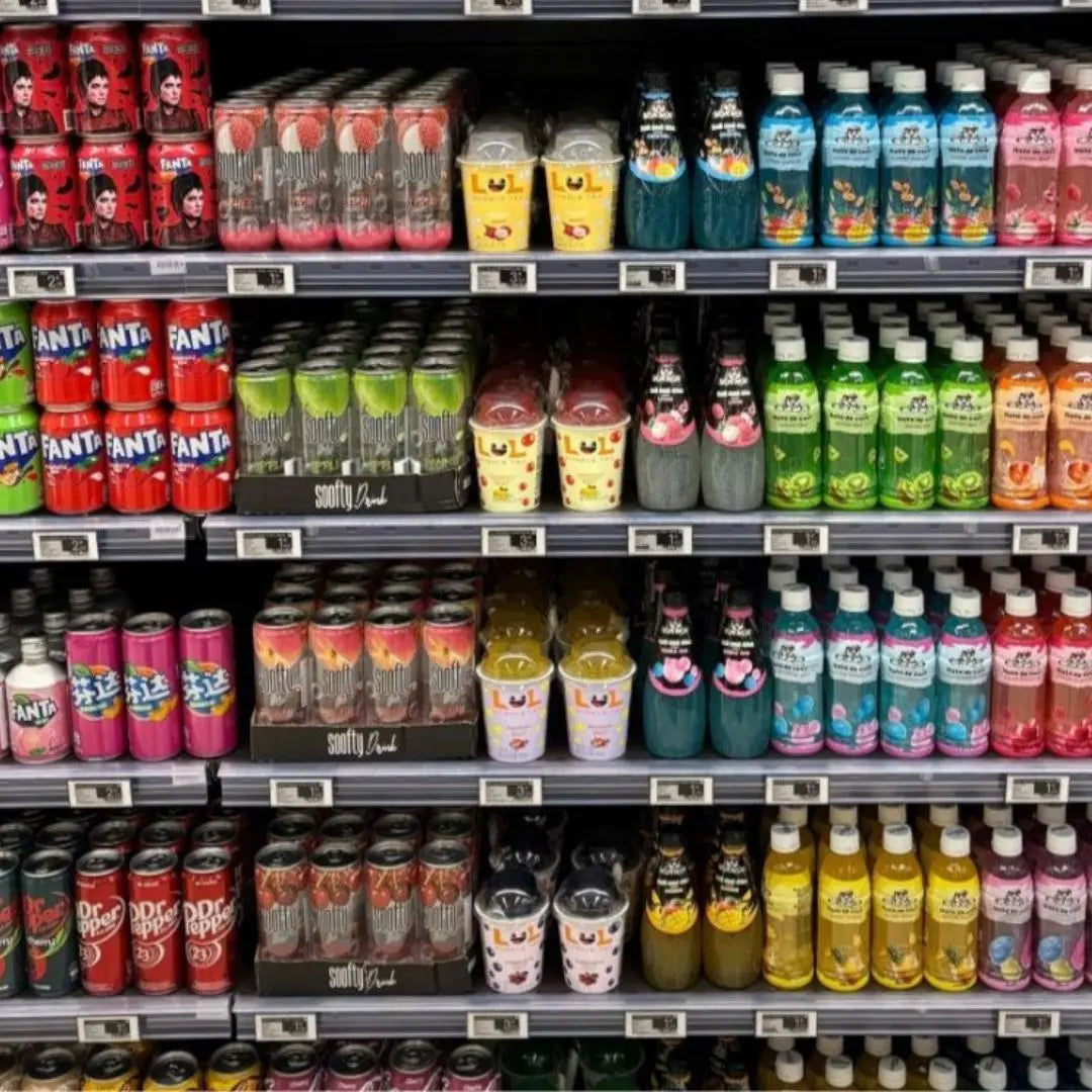 Supermarket shelf stocked with various drinks including LOL Bubble Tea