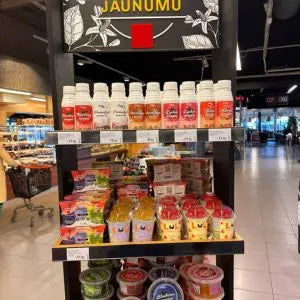 Display shelf with various products in a store setting including LOL Bubble Tea